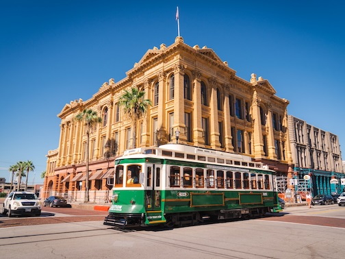 Walkers standing in front of Houston is Inspired mural