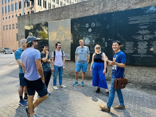 Tour guide with welcoming look at Tranquility Park